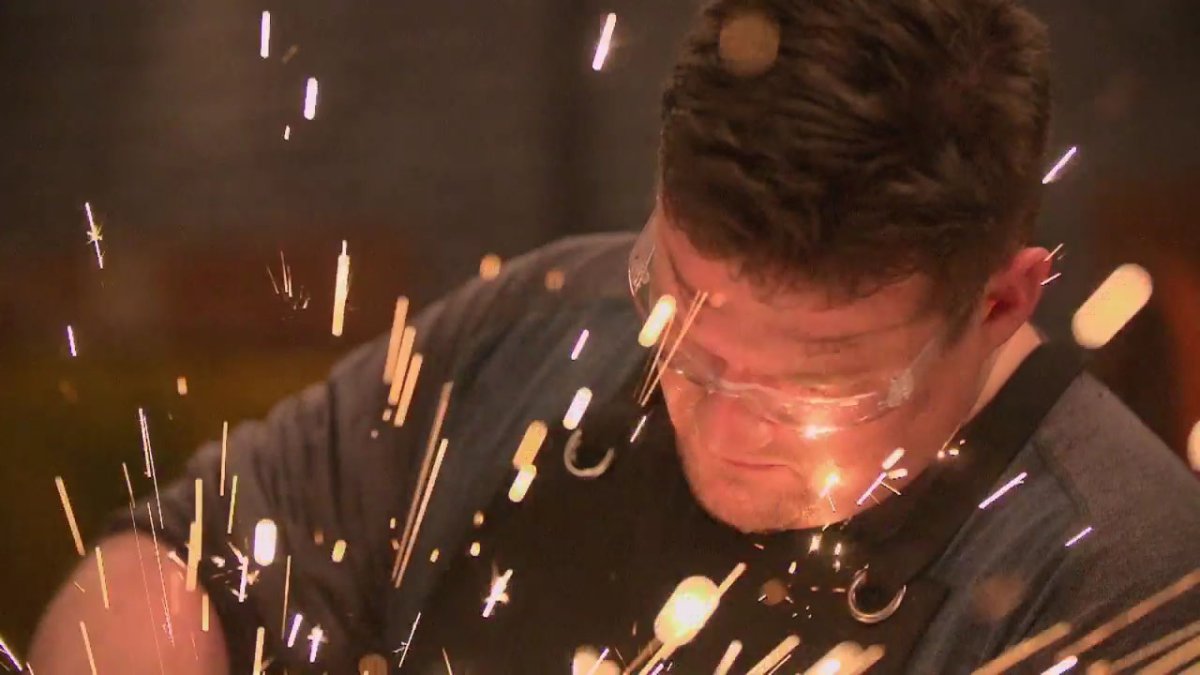 sparks flying around elija, a metal smith 